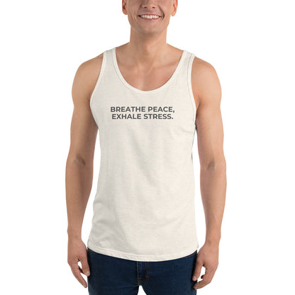 Man wearing a oatmeal triblend sleeveless tank with "Breathe Peace, Exhale Stress" text.