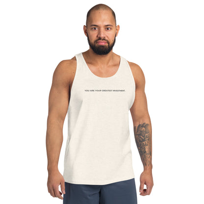 Man wearing a oatmeal triblen sleeveless tank with "You Are Your Greatest Investment" text. 