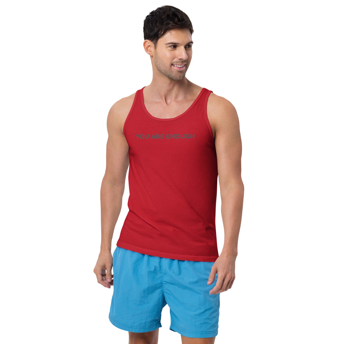 Man wearing a red sleeveless tank with "You Are Enough" text. 