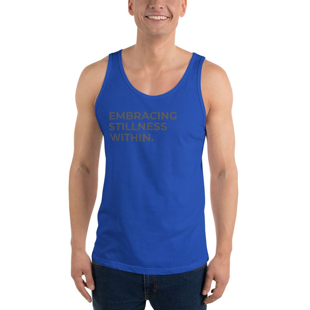 Man wearing a royal sleeveless tank with "Embracing Stillness Within" text. 