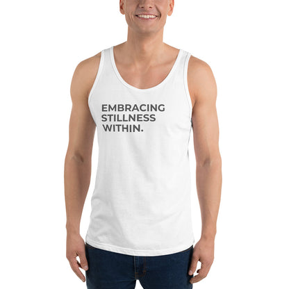 Man wearing a white sleeveless tank with "Embracing Stillness Within" text. 