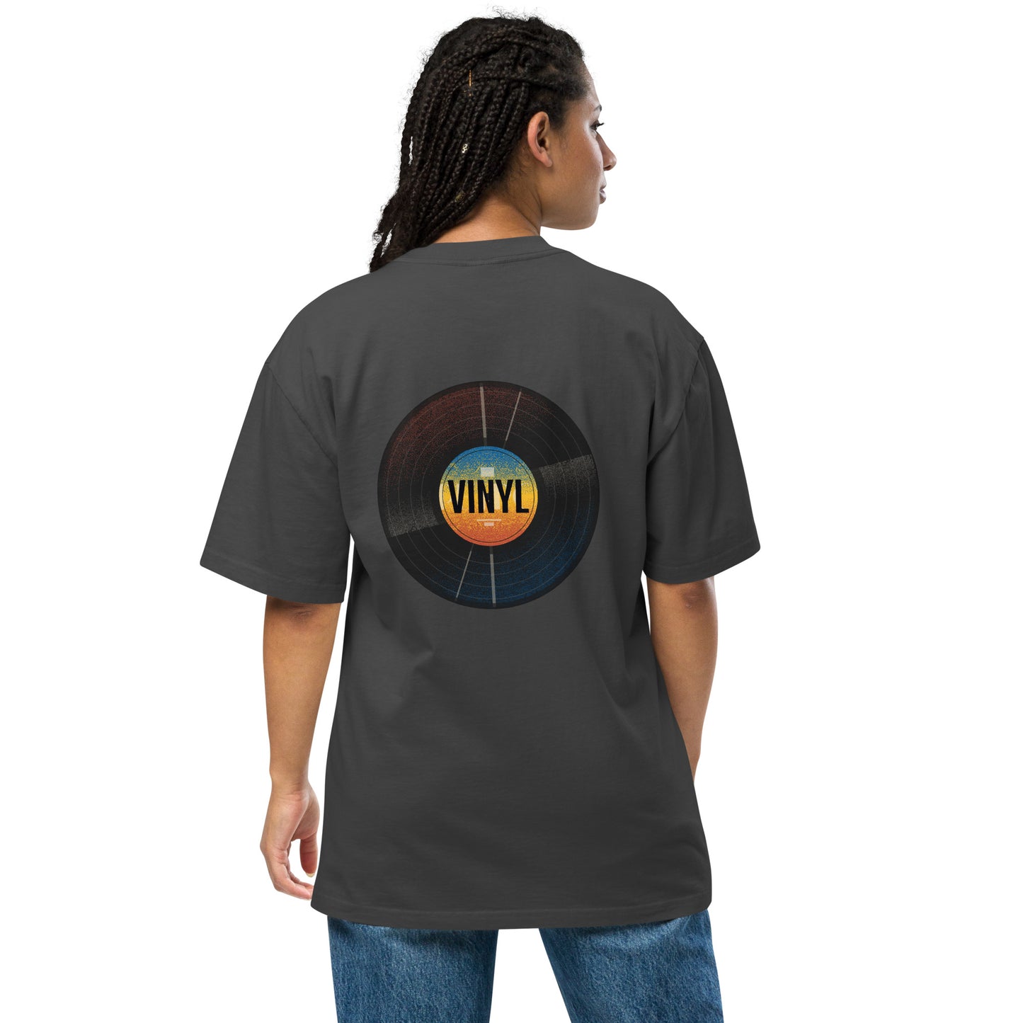 Woman from the back wearing a Be You Out Loud faded black oversized tee with a colorful vinyl record design, merging classic charm with modern fashion.