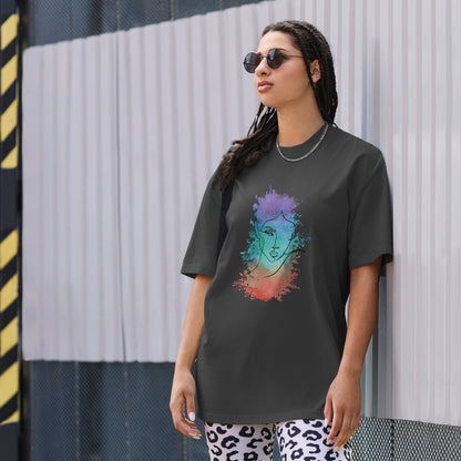 Woman in a faded black oversized tee showcasing a vibrant artistic face design, reflecting Be You Out Loud’s celebration of individuality and self-expression.