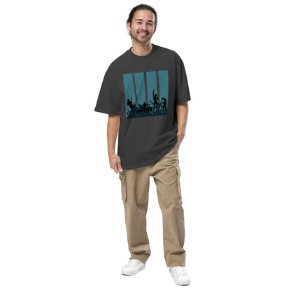 Man in faded black Men's Oversized Tee featuring a retro band silhouette graphic,