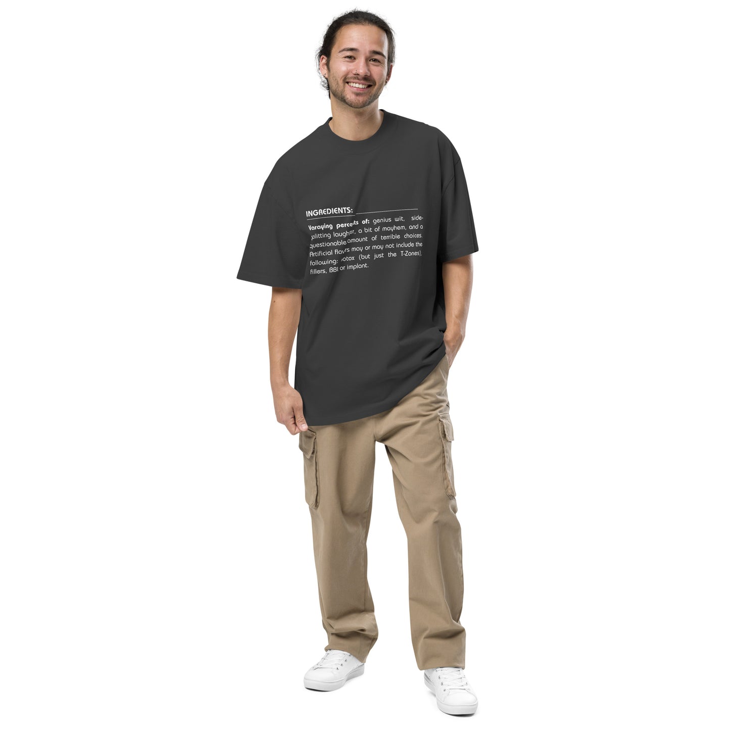 Man wearing Men’s 'Ingredients of Cool' faded black Oversized Tee, showcasing the humorous text graphic.