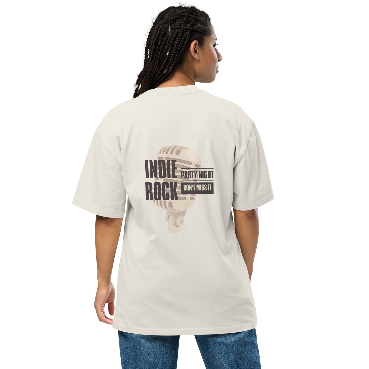 Woman viewed from the back wearing a faded bone oversized tee with 'INDIE ROCK' text and microphone graphic, promoting 'Party Night – Don’t Miss It', paired with denim jeans, conveying a relaxed music event vibe.