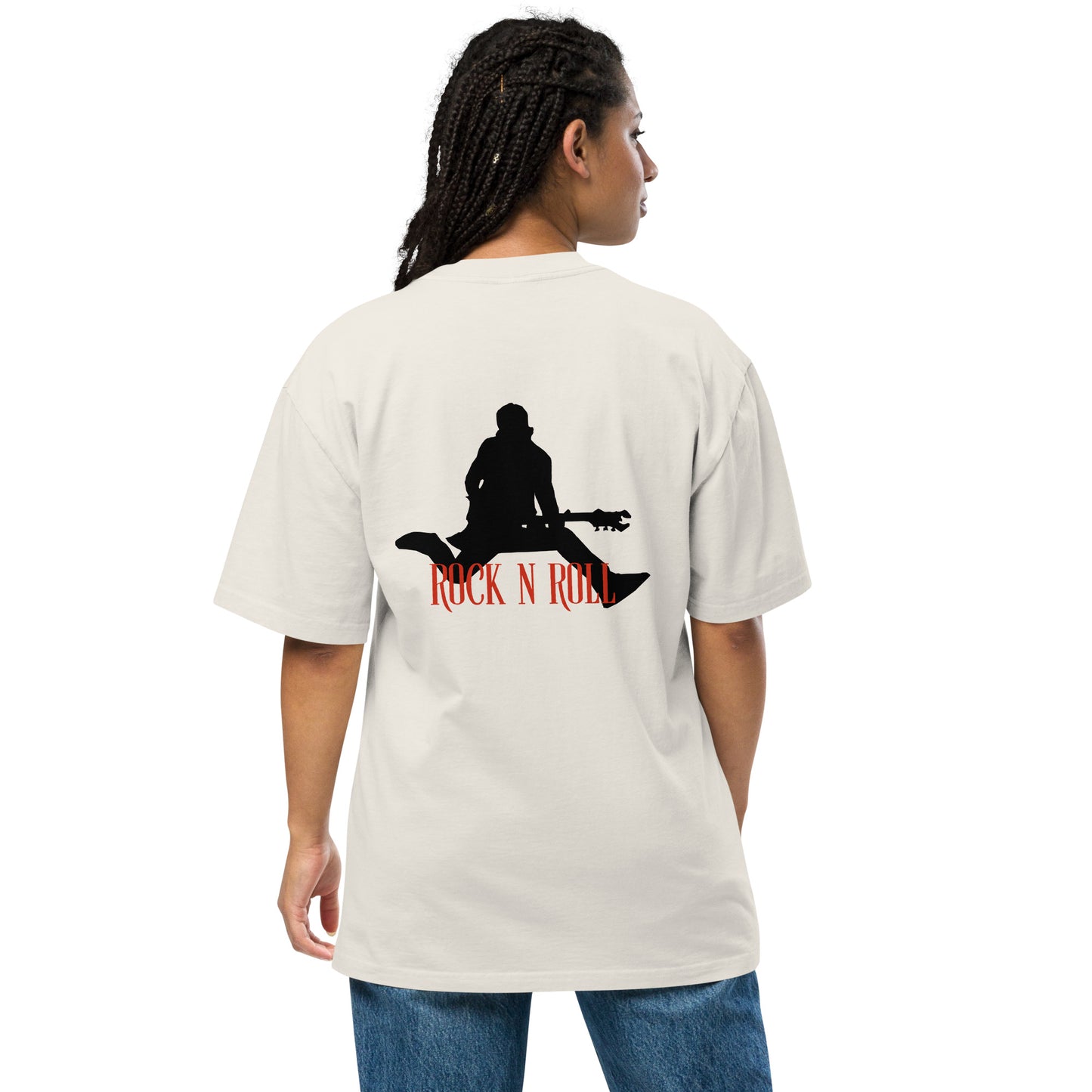 Woman facing away, wearing a Be You Out Loud faded bone oversized tee with a "Rock N Roll" silhouette design, exuding a vintage yet edgy style