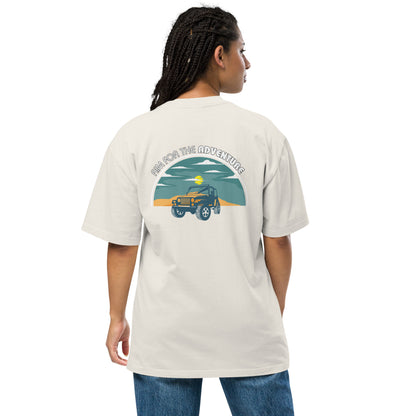 Woman showcasing Women's Quirky Adventure faded bone Oversized Graphic Tee with retro jeep design, ideal for those who love a dash of whimsy on their adventures.