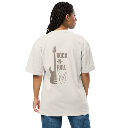 Woman turns heads in a Women's Rockin’ Retro faded bone Oversized Graphic Tee featuring a vintage guitar and rock hand gesture, embodying the timeless spirit of rock n' roll.