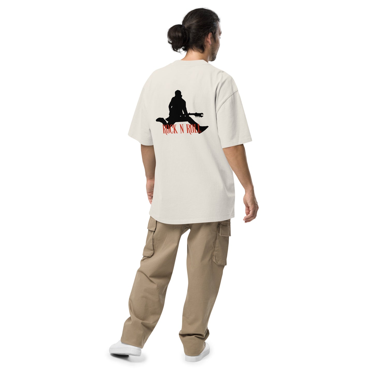 Rear view of a man wearing  Men’s Iconic Rock n’ Roll faded bone Oversized Tee, exuding a timeless, rebellious spirit.