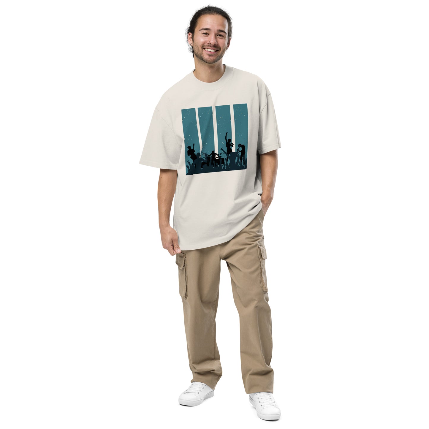 Man in faded bone Men's Oversized Tee featuring a retro band silhouette graphic,