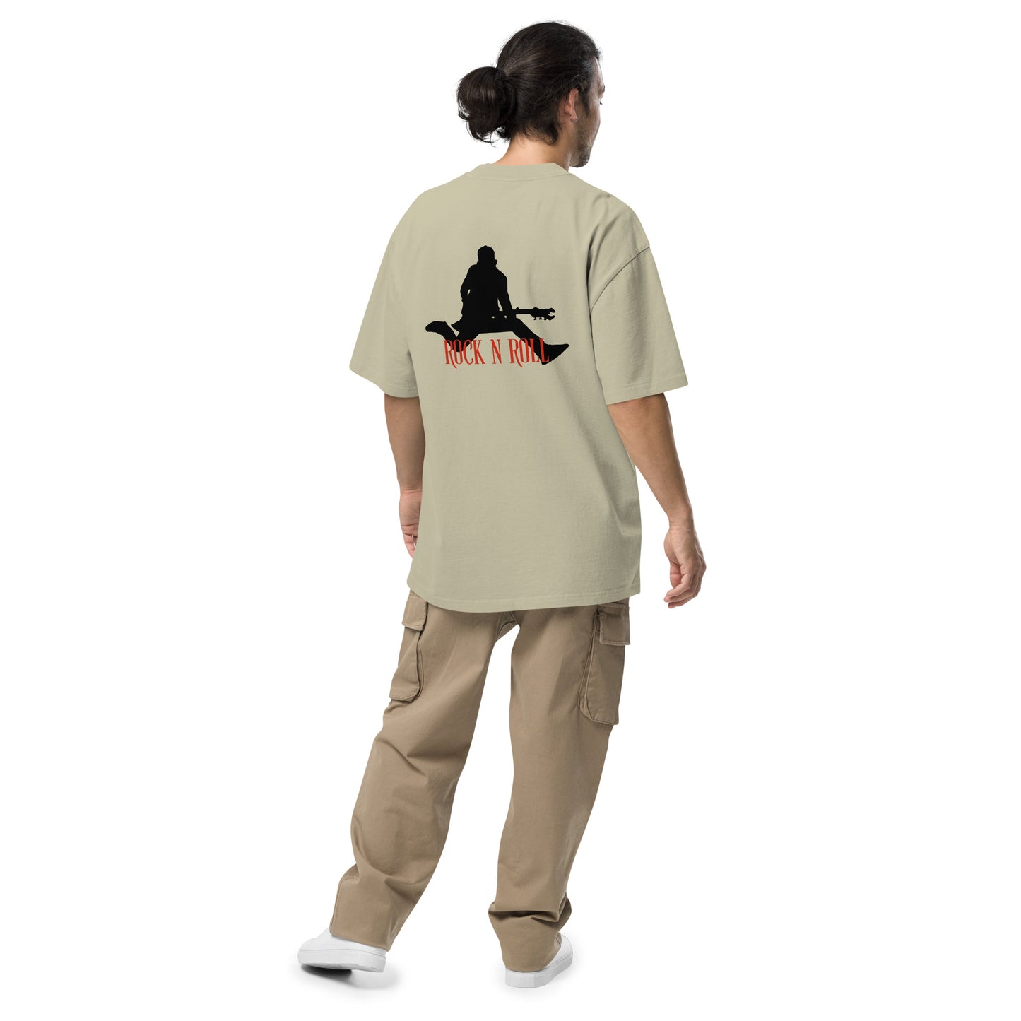 Rear view of a man wearing  Men’s Iconic Rock n’ Roll faded eucalyptus Oversized Tee, exuding a timeless, rebellious spirit.