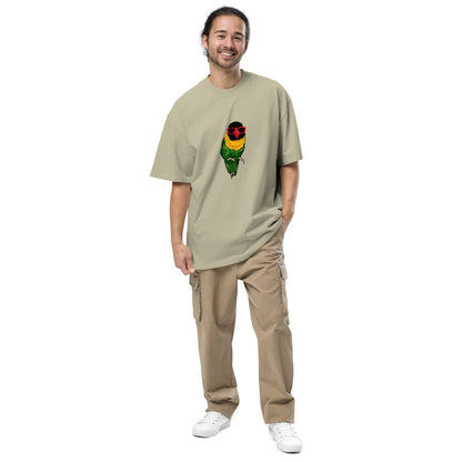 A man with a warm smile is featured wearing a eucalyotus t-shirt with a colorful graphic of a parrot wearing red sunglasses on the chest. The fun, quirky graphic adds a pop of color and humor to the outfit, which is completed with beige cargo pants and white sneakers for a comfortable, casual look.