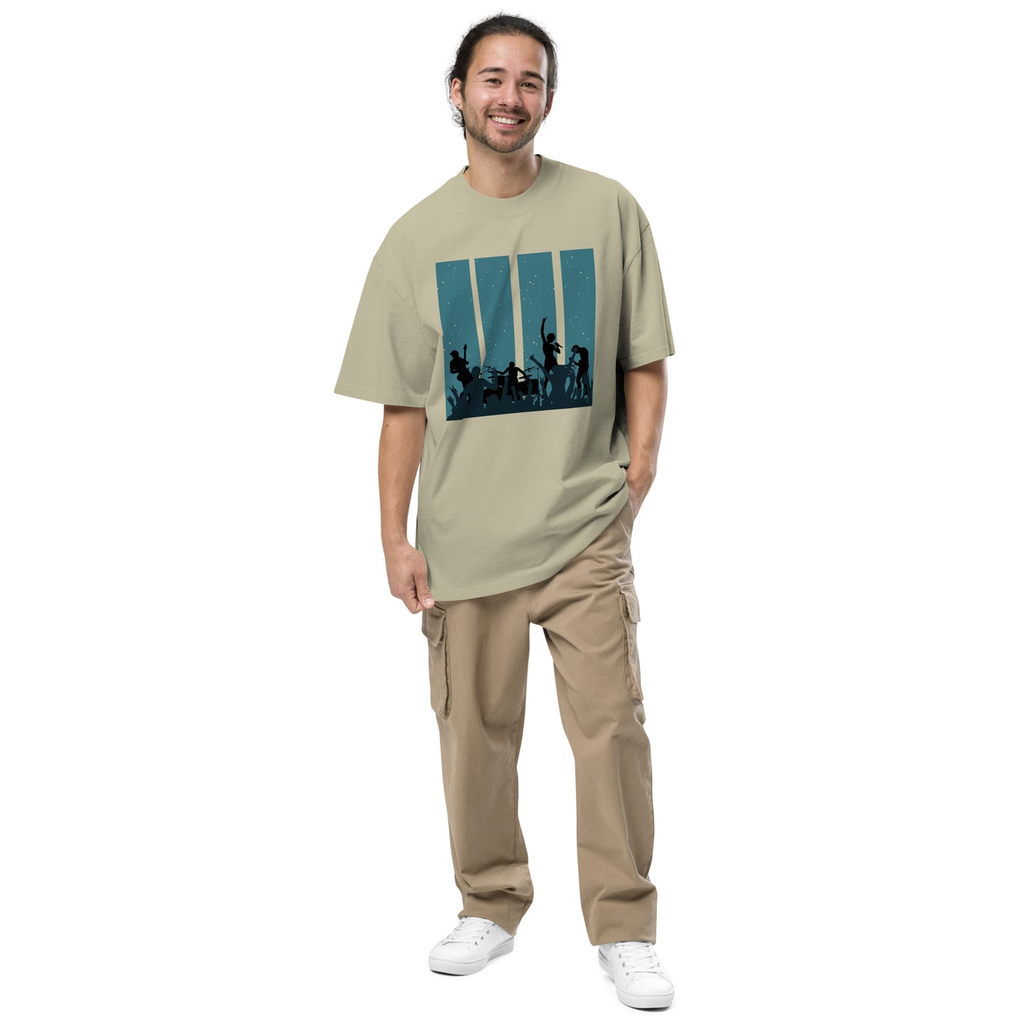 Man in faded eucalyptus Men's Oversized Tee featuring a retro band silhouette graphic,