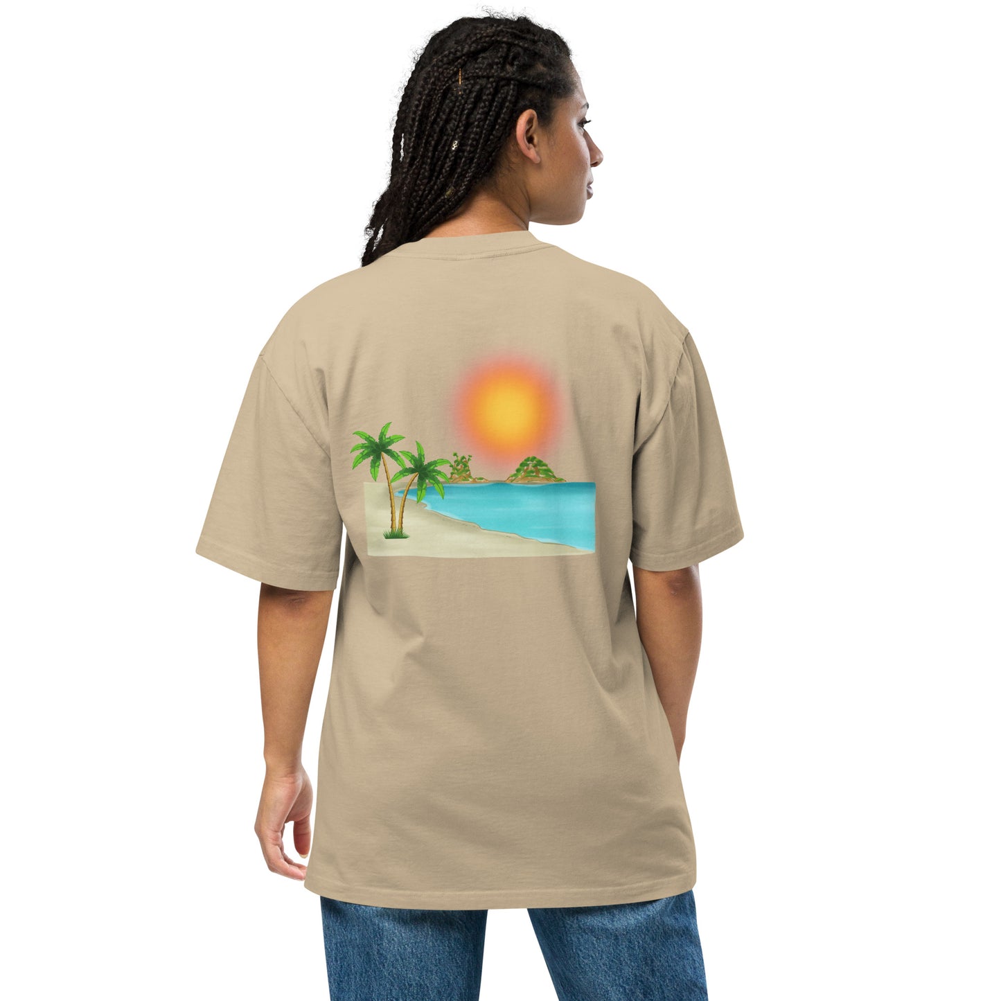 Woman in a faded khaki oversized T-shirt with a vibrant beach sunset graphic.