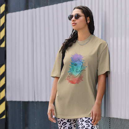 Woman in a faded khaki oversized tee showcasing a vibrant artistic face design, reflecting Be You Out Loud’s celebration of individuality and self-expression.