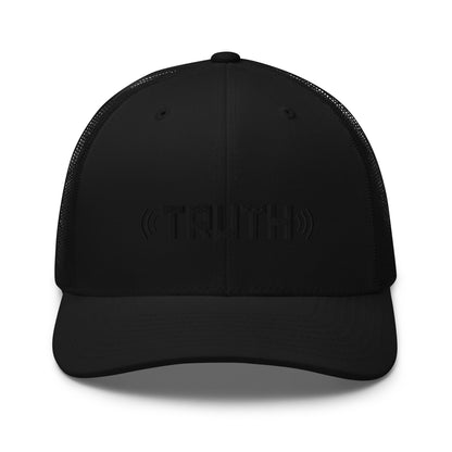 Black trucker cap with the word "TRUTH" in black, flanked by sound wave symbols, featuring a mesh back and an adjustable strap, available in multiple colors.