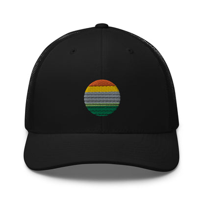 Black trucker cap with an embroidered colorful striped sunrise design in the center, featuring a mesh back and adjustable strap, available in multiple base colors.