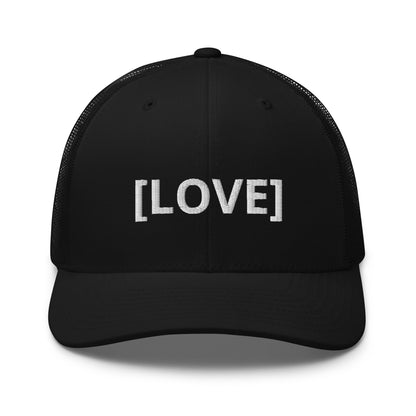 Black trucker cap with the word 'LOVE' embroidered in white within brackets, symbolizing an inclusive message, featuring a mesh back and available in multiple colors.