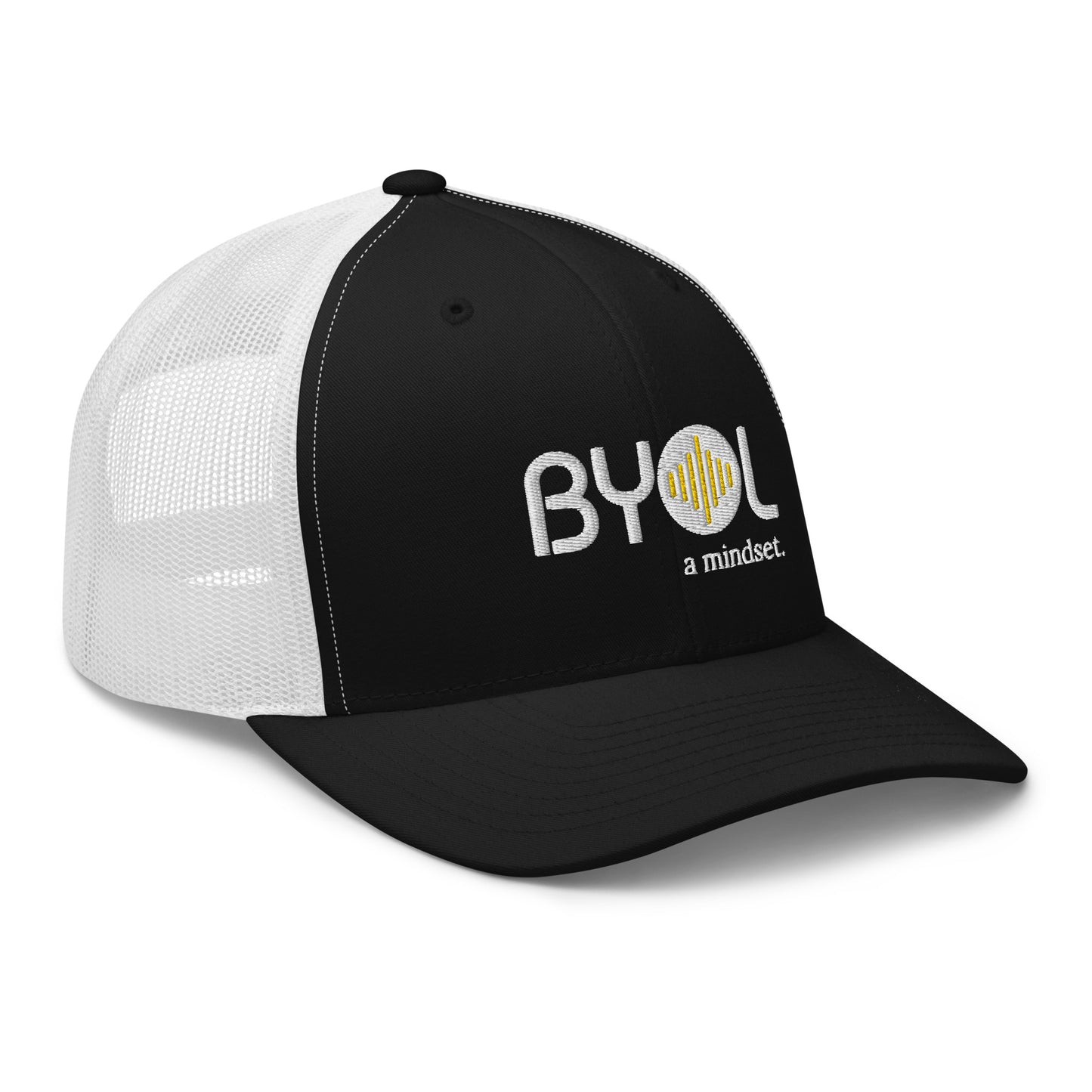 Black and white retro trucker hat with "BYOL a mindset" embroidered on the front in white and yellow, displayed against a clean background. Available in various colors: black, white, brown, green, and beige.