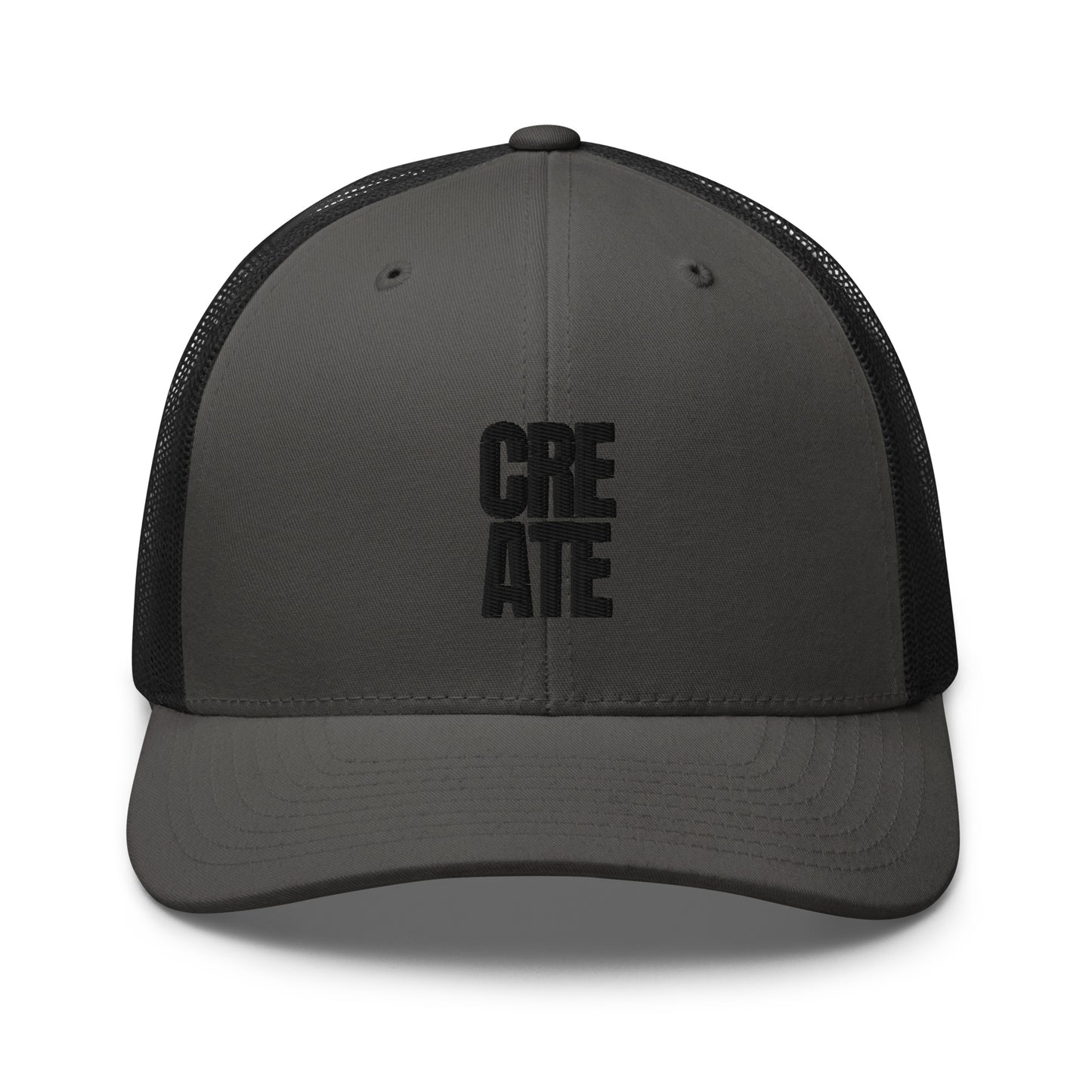 Grey and black trucker cap with "CREATE" embroidered in black on the front, featuring a mesh back and adjustable strap.