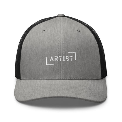 Grey and Black trucker cap with white "ARTIST" embroidery on the front, featuring a mesh back and an adjustable strap for a personalized fit.