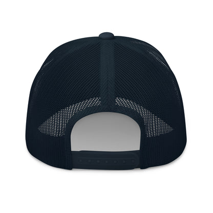 Rear view of a navy blue trucker cap with a mesh back and an adjustable snap closure.