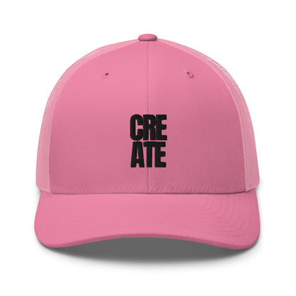 pink trucker cap with "CREATE" embroidered in black on the front, featuring a mesh back and adjustable strap.