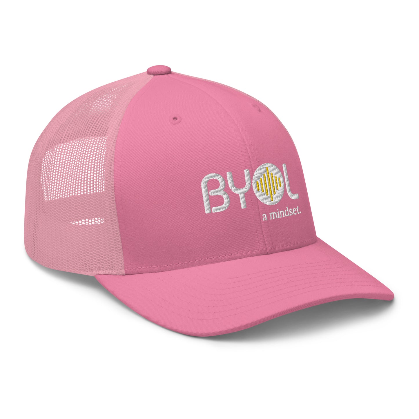 Pink retro trucker hat with "BYOL a mindset" embroidered on the front in white and yellow, displayed against a clean background. Available in various colors: black, white, brown, green, and beige.