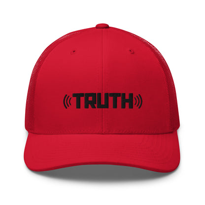 Red trucker cap with the word "TRUTH" in black, flanked by sound wave symbols, featuring a mesh back and an adjustable strap, available in multiple colors.