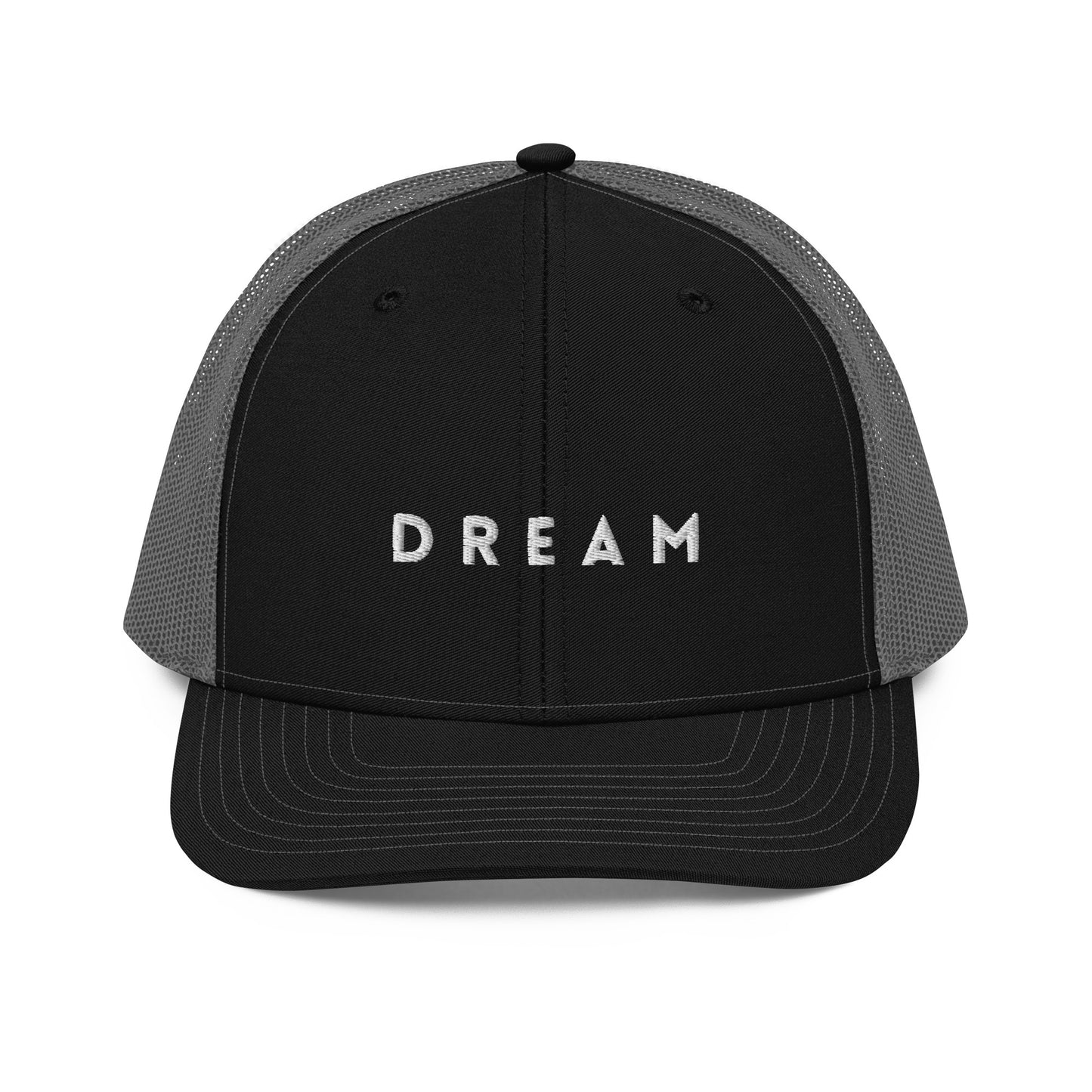 An black and grey snapback trucker cap featuring the word "DREAM" in bold white letters embroidered across the front panel. This cap is designed with a curved visor, structured front crown, and breathable mesh panels on the sides and back, complete with an adjustable snap closure for a personalized fit.