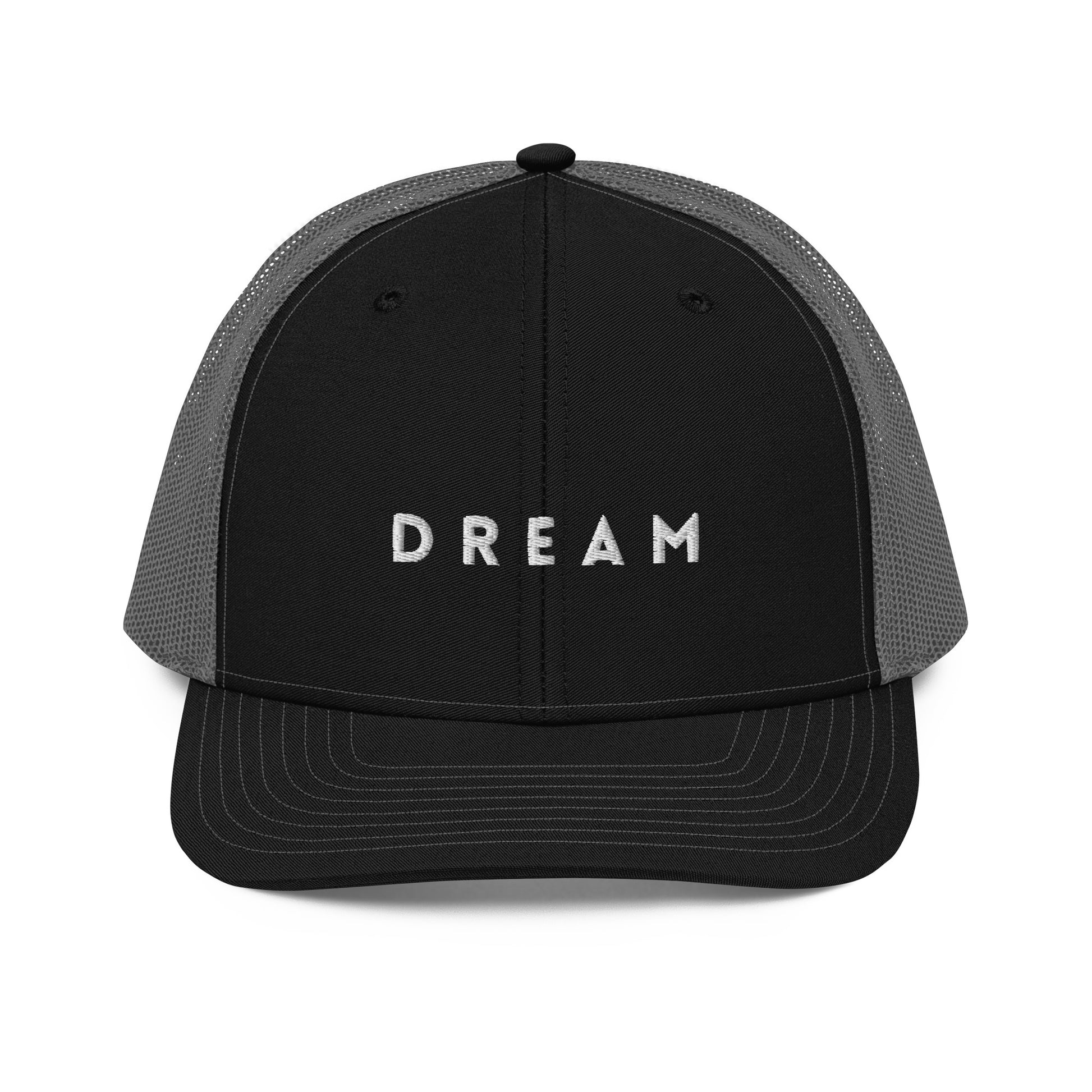 An black and grey snapback trucker cap featuring the word "DREAM" in bold white letters embroidered across the front panel. This cap is designed with a curved visor, structured front crown, and breathable mesh panels on the sides and back, complete with an adjustable snap closure for a personalized fit.