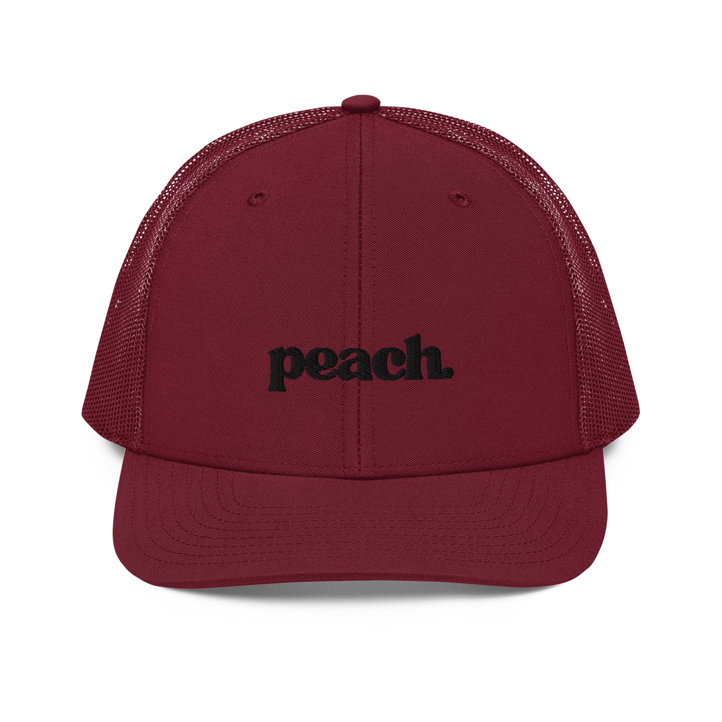 A front view of an maroon snapback trucker cap, featuring the word "peach." in a casual black script embroidered on the front panel. The cap has a pre-curved visor, a button top, and breathable mesh panels on the sides and back for a comfortable fit.