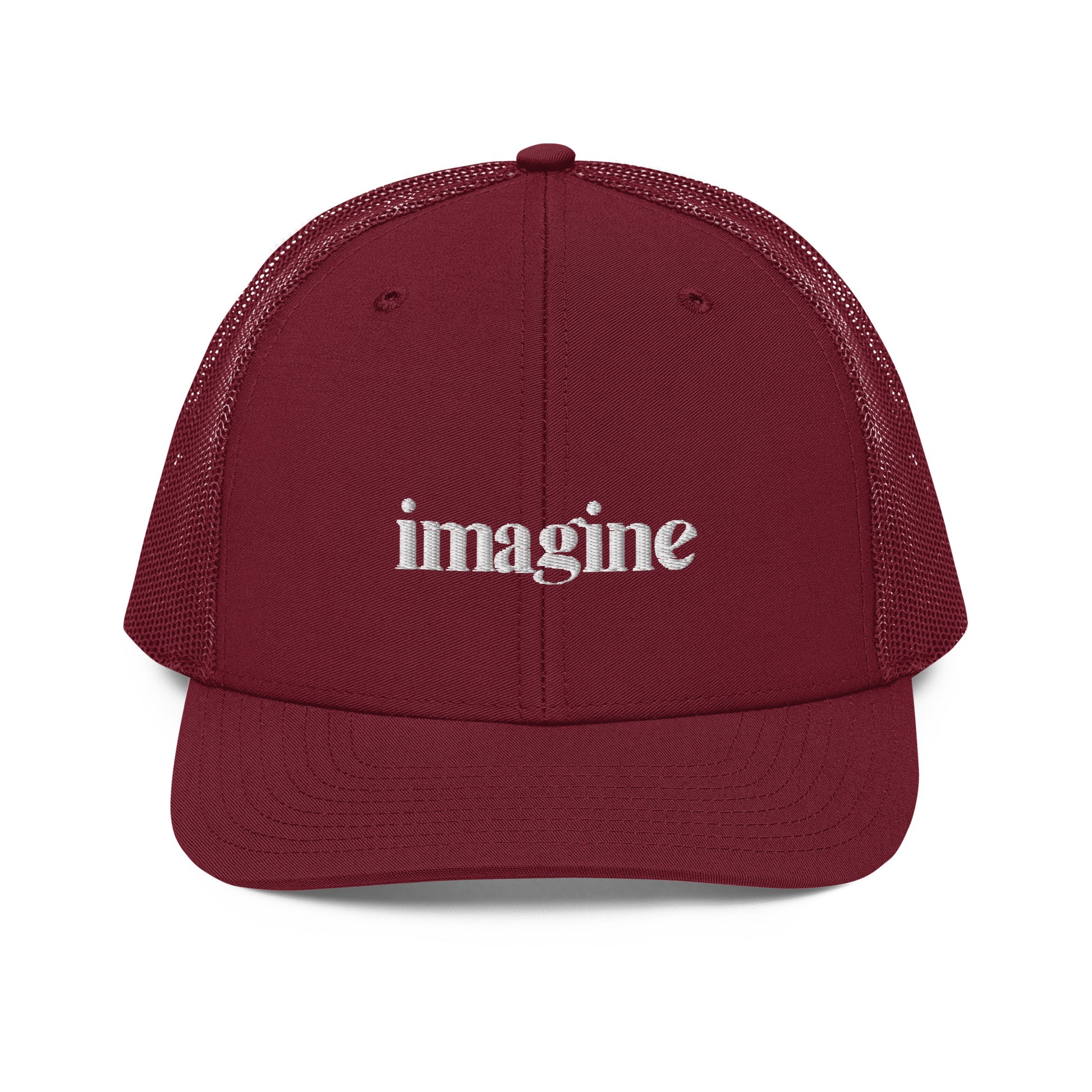 A maroon snapback trucker cap with the word "imagine" embroidered in white cursive letters on the front panel. The hat features a curved visor, structured front panels, and breathable mesh on the sides and back, with an adjustable snap closure for a comfortable, customized fit.