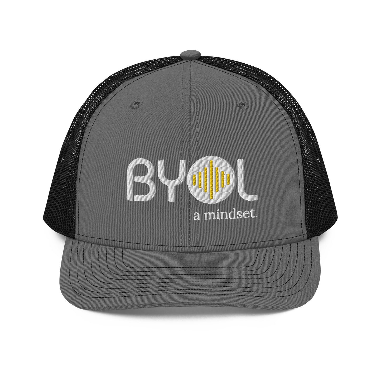 Grey and black pre-curved contrast stitched trucker hat with "BYOL a mindset" embroidered on the front in white and yellow, displayed against a clean background. Available in various colors: maroon, black, green, and gray.