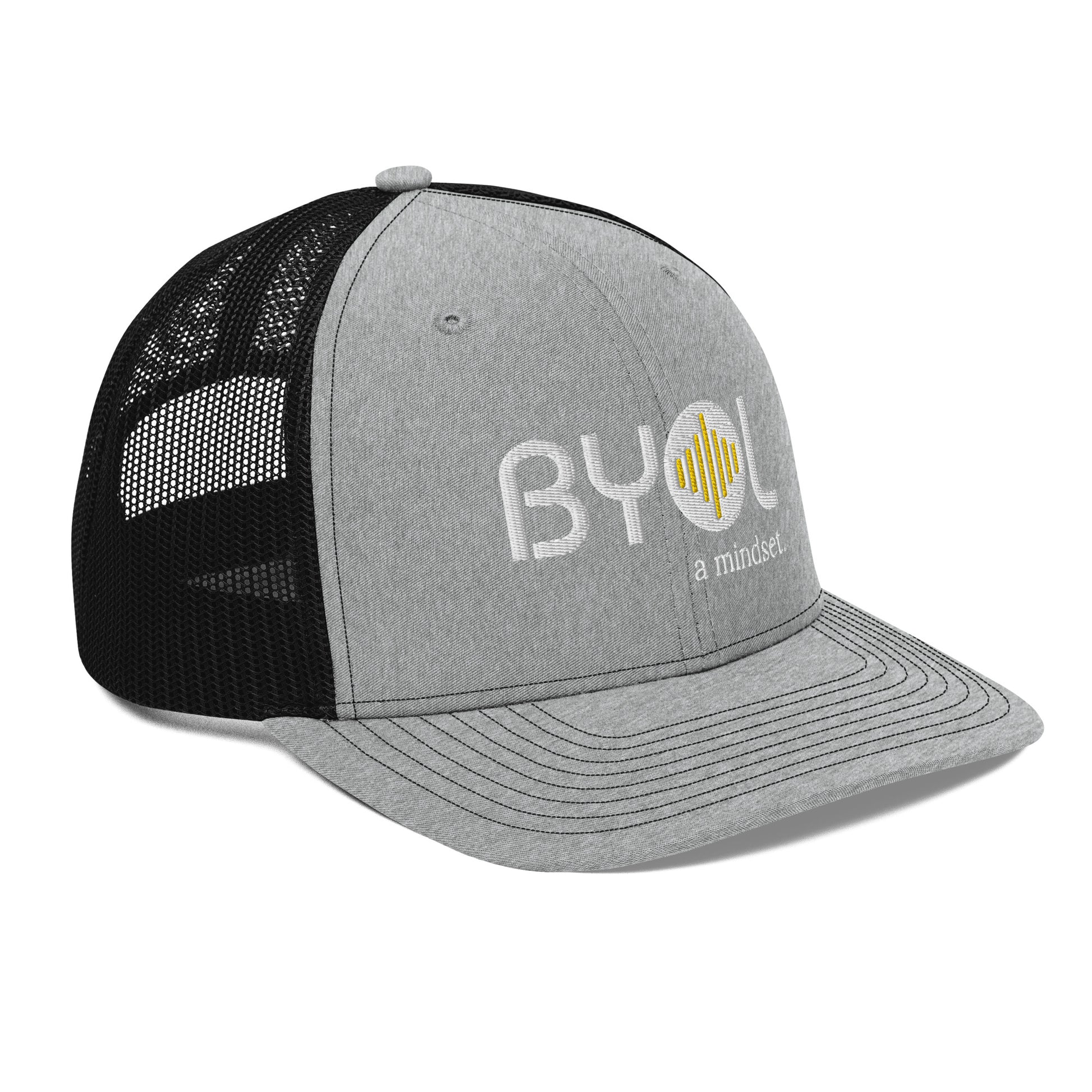 Light grey and black pre-curved contrast stitched trucker hat with "BYOL a mindset" embroidered on the front in white and yellow displayed against a clean background. Available in various colors: maroon, black, green, and gray.