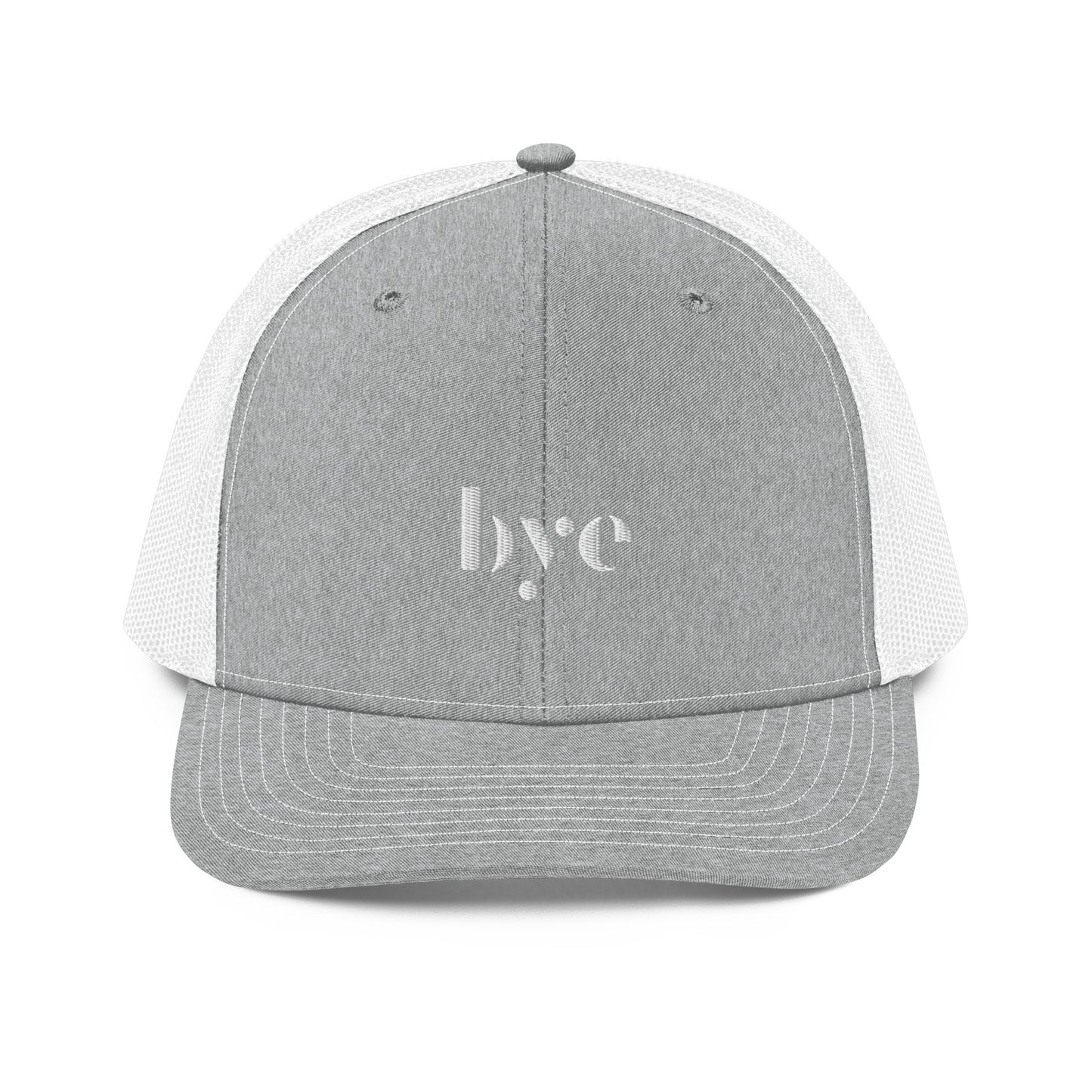 A structured light grey and white trucker cap mesh back. The front features a white embroidered logo that reads "b.y.e" in lowercase letters. The cap has a curved brim with stitching detail and an adjustable snapback closure at the rear.