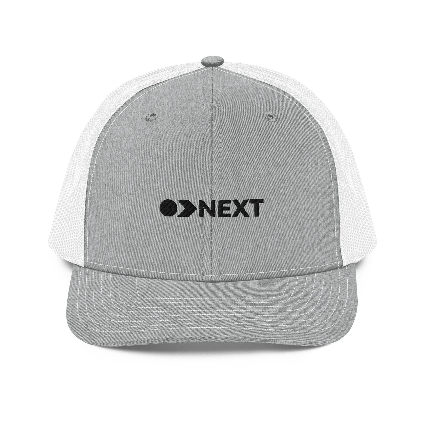 A grey and white' snapback trucker cap featuring a front panel with a black embroidered logo that reads "NEXT" with an eye-like symbol as the 'E.' The cap has a curved brim and breathable mesh panels on the sides and back, complete with a button top and adjustable strap for a versatile fit.