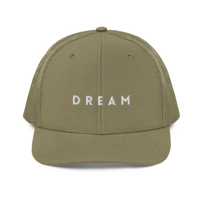 An military green snapback trucker cap featuring the word "DREAM" in bold white letters embroidered across the front panel. This cap is designed with a curved visor, structured front crown, and breathable mesh panels on the sides and back, complete with an adjustable snap closure for a personalized fit.