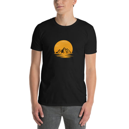 Man wearing a black soft cotton t-shirt with a mountain sunset design, perfect for inspiring bold self-expression