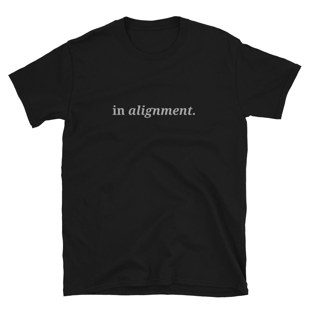 Black t-shirt with the phrase "in alignment." printed on the front, available in color options black, navy blue, gray, and white, available in sizes S to 3XL.