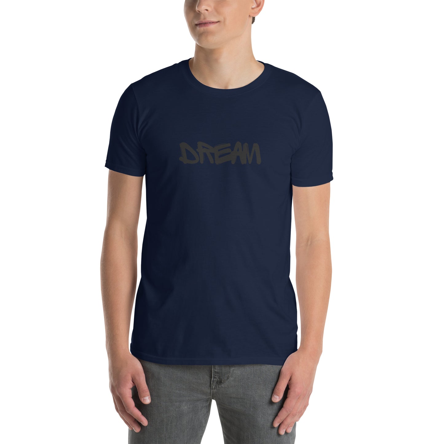 A young man is wearing a Navy Blue t-shirt with the word "DREAM" written in a freehand, black font across the chest, conveying a message of hope and ambition.