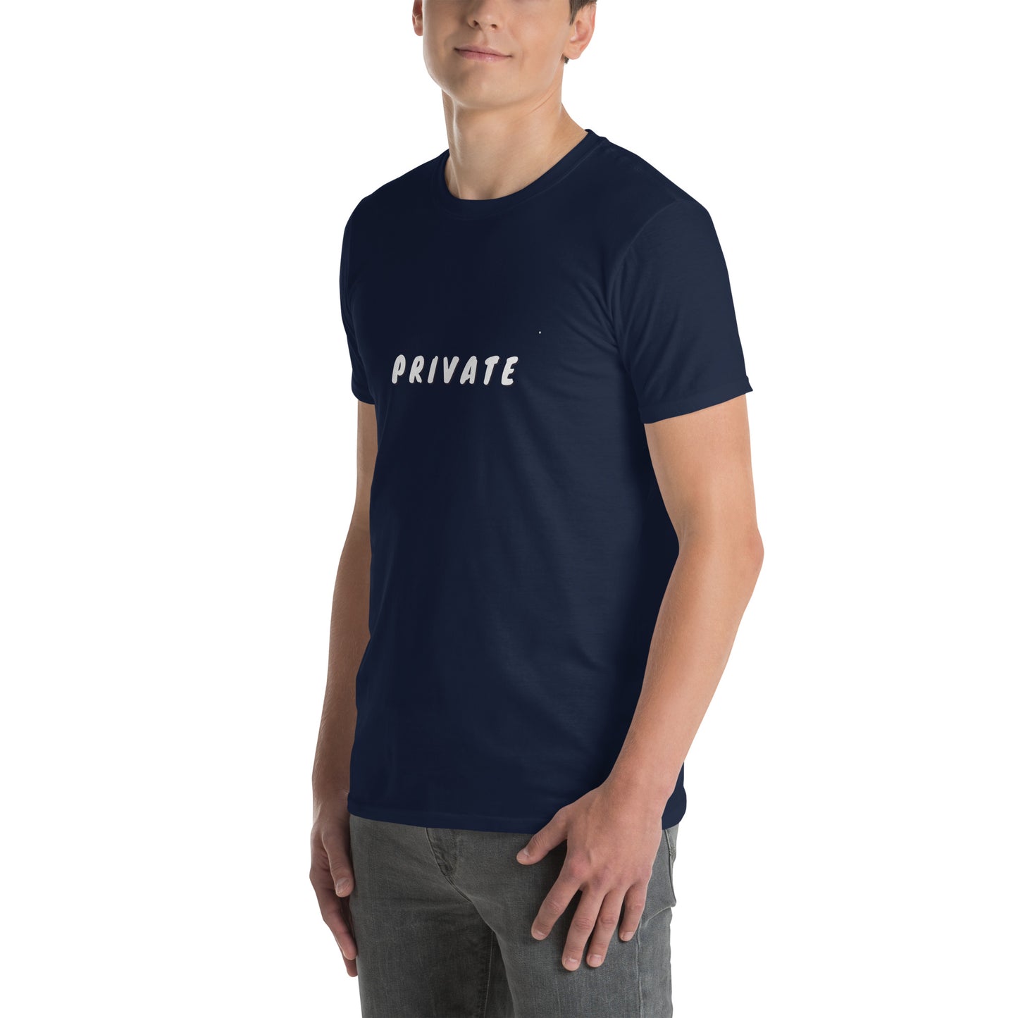 A man is wearing a navy blue t-shirt with the word "PRIVATE" printed across the chest in white capital letters, standing casually with one hand partially in his pocket.