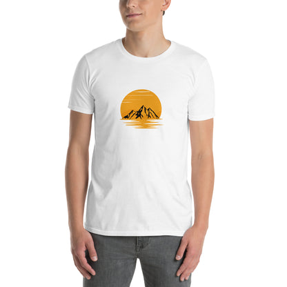 Man wearing a white soft cotton t-shirt with a mountain sunset design, perfect for inspiring bold self-expression