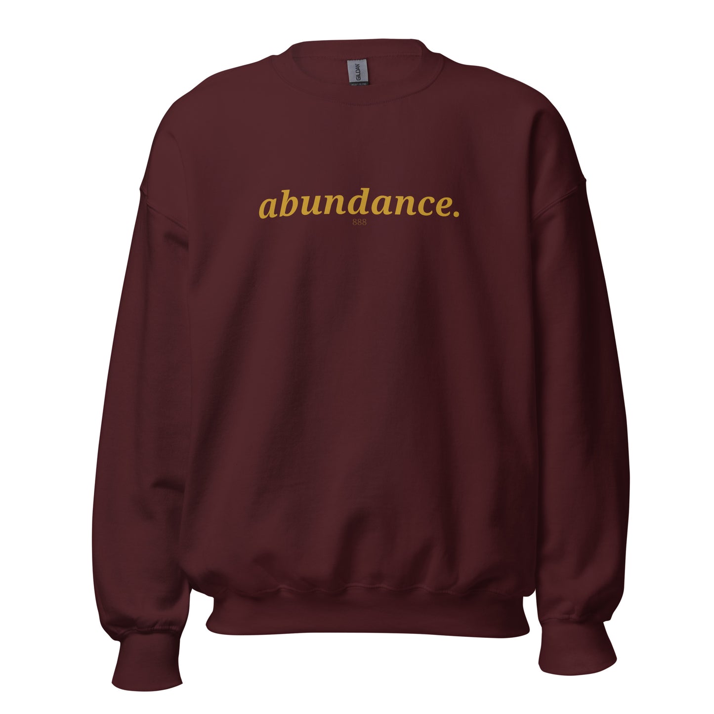 Maroon sweatshirt with the phrase "abundance." printed on the front, available in color options navy blue, green, maroon, gray, and pink, available in sizes S to 3XL.