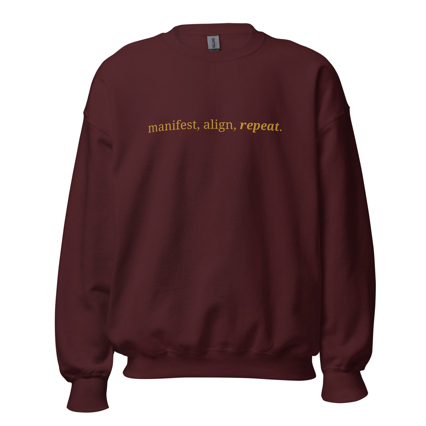 Maroon sweatshirt with the phrase "manifest, align, repeat." printed on the front, available in color options navy blue, green, maroon, gray, and pink, available in sizes S to 3XL.