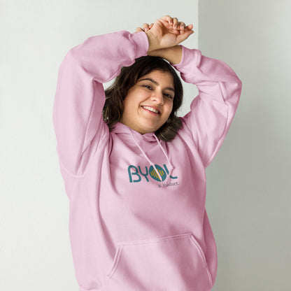 Woman wearing a light blue BYOL mindset hoodie with color options in black, maroon, olive green, and gray, available in sizes S to 5XL.