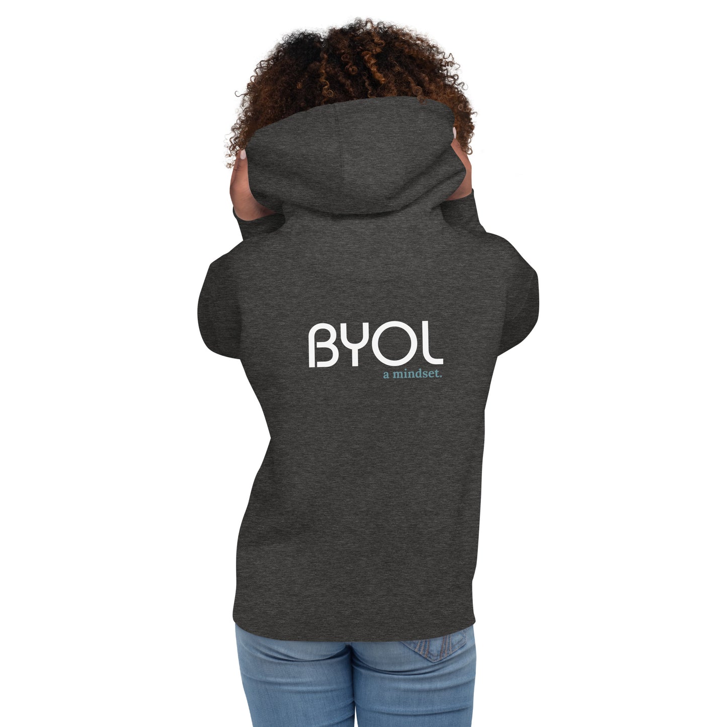 Back view of a woman wearing a dark heather grey BYOL mindset hoodie with color options in black, maroon, dark gray, and light pink, available in sizes S to 3XL.