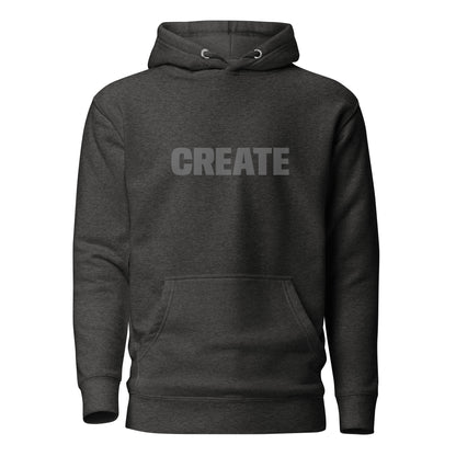 Charcoal heather grey "Create" printed premium hoodie with front pouch pocket, adjustable drawstrings, and soft fleece lining.