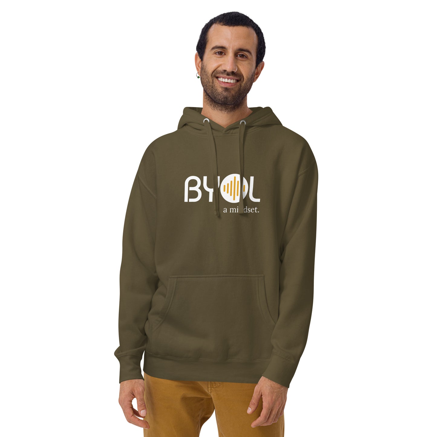 A young man with short hair and a beard wearing a military green "BYOL: a mindset" hoodie, smiling and standing with his arms at his sides. The hoodie features the "BYOL" logo in white and yellow on the front and is available in multiple colors (black, dark gray, maroon, pink, light gray, plus more) and sizes (S-3XL). The "be you out loud" logo is displayed at the top.